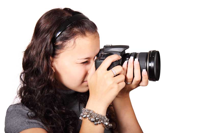 A photographer prepares to take a photograph